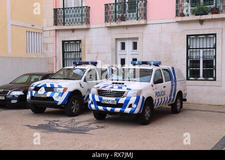 LISBON, PORTUGAL - JUNE 4, 2018: Mitsubishi L200 and Toyota Hilux of Portugal Police. The full name of the Portugese force is Public Security Police ( Stock Photo