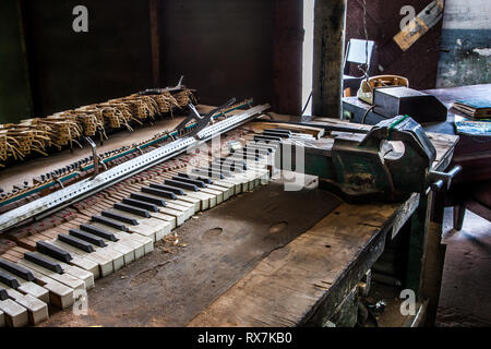Havana, Cuba. 26th May, 2009. Piano keys laid out on a table at the workshop of instrument repair in Havana Cuba. Stock Photo
