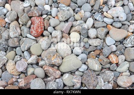 Pebbly beach background from Crete, Greece. Shingle beach. Stock Photo