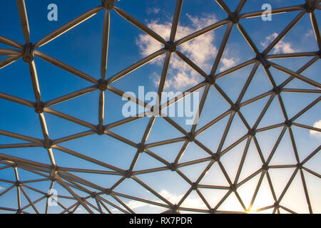 Curved ceiling of dome with geometric frame structure in black steel ...