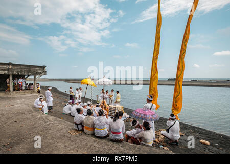 Balinese religious beach ceremony, Tabanan, Bail, Indonesia Stock Photo