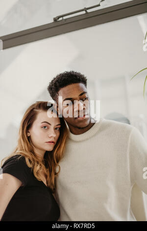 Smiling young couple poses for a portrait in Cologne, Germany stock photo