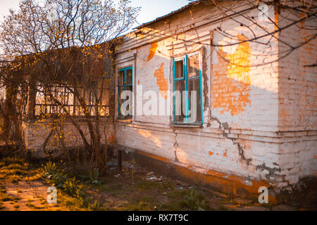 old abandoned house with cracks in summer Stock Photo