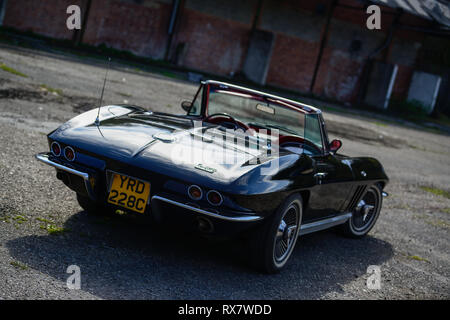 1966 Chevrolet Corvette Stingray convertible parked near an old works Stock Photo