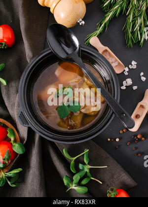 High angle view of vegetable soup with bread served in bowl on table