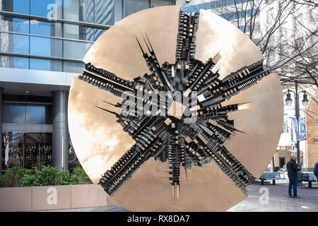 Charlotte, USA - February 24, 2019: Grande Disco, also known as The Grand Disc, is a round coin-shaped piece of art that sits at Bank of America Plaza Stock Photo