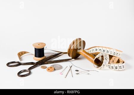 Tailor still life set - vintage tools for handmade custom tailoring industry. On white background. Stock Photo