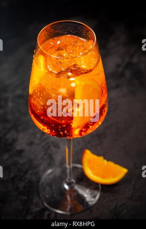 Classic italian aperol spritz cocktail in glass on dark background Stock Photo