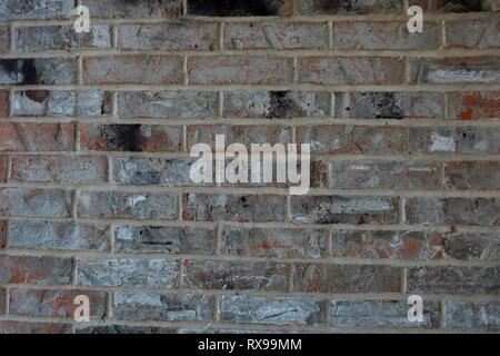 red, orange, grey, white, and black brick background wall Stock Photo