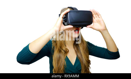 Young woman wearing virtual reality goggles headset, vr box. Connection, technology, new generation and progress concept. Studio shot on white backgro Stock Photo