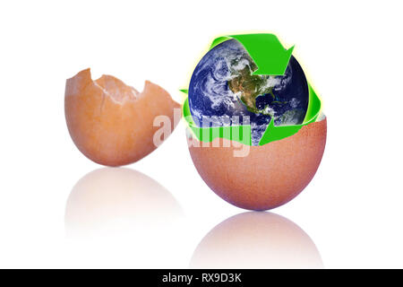 Cracked brown egg showing recycling symbol over planet earth inside. Avoid waste by recycling calcium-rich eggshells in compost or gardening activitie Stock Photo