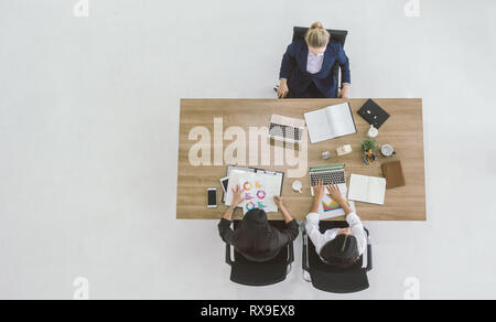 top view of businesswoman discussing working at table in office. Stock Photo