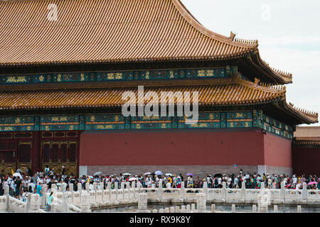 Tourists visiting Forbidden City against sky Stock Photo