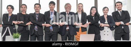 Asian business team Colleagues With Holding Hands together side by side showing teamwork successful concept Stock Photo