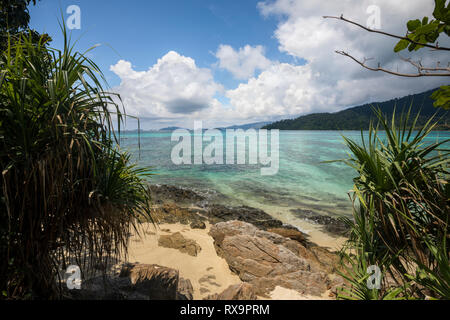 Scenic view of sea against cloudy sky during sunny day Stock Photo