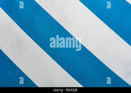 Blue and white background diagonal stripes pattern top view - Bicolor point of view on textile backdrop pattern - Wide line stripes of clothes Stock Photo