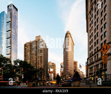 Low angle view of buildings against sky in city during sunset Stock Photo