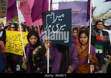 Lahore, Pakistan. 08th Mar, 2019. Women activists from different civil society hold placards during their protest rally from Press Club to Punjab Assembly in connection with International Women's Day. As World observed 8th March International Women Day globally. International Women's Day is marked on March 08 every year and is a global day celebrating the economic, political and social achievements of women past, present and future. Credit: Rana Sajid Hussain/Pacific Press/Alamy Live News Stock Photo