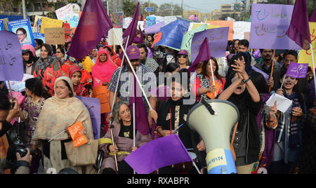 Lahore, Pakistan. 08th Mar, 2019. Women activists from different civil society hold placards during their protest rally from Press Club to Punjab Assembly in connection with International Women's Day. As World observed 8th March International Women Day globally. International Women's Day is marked on March 08 every year and is a global day celebrating the economic, political and social achievements of women past, present and future. Credit: Rana Sajid Hussain/Pacific Press/Alamy Live News Stock Photo