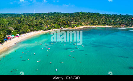 Aerial. Surf beach Hiriketiya, Dikwella, Sri Lanka. Stock Photo