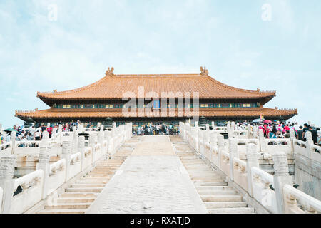 Low angle view of tourists visiting Forbidden City against sky Stock Photo