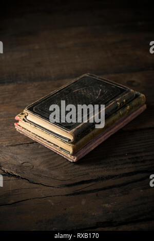 High angle view of old books on wooden table Stock Photo