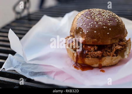 Close-up of pulled pork sandwich on barbecue grill Stock Photo