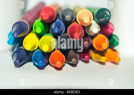 Stacked multi color paster crayon isolated on white background Stock Photo