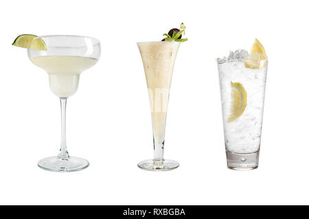 A variety of alcoholic drinks, beverages and cocktails on a white background. Three drinks in different glass goblets. Isolated. Stock Photo