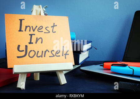 Handwritten text Invest in yourself. Self motivation concept. Stock Photo