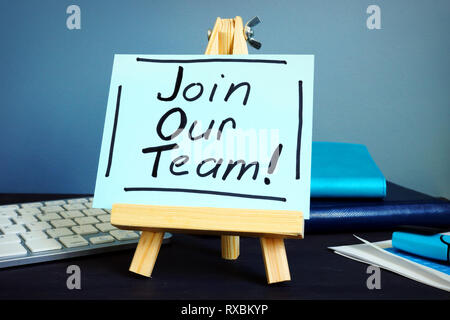 Join our team written text on the table. Hiring and recruitment. Stock Photo
