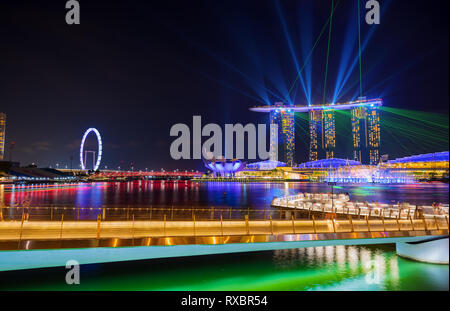 SINGAPORE CITY, SINGAPORE - MARCH 3, 2019: Spectra Light and Water Show Marina Bay Sand Casino Hotel Downtown Singapore Stock Photo