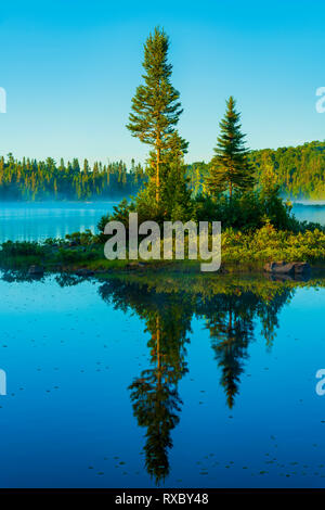 Island in Mijinemungshing Lake early morning, Lake Superior Provincial Park, Ontario, Canada Stock Photo