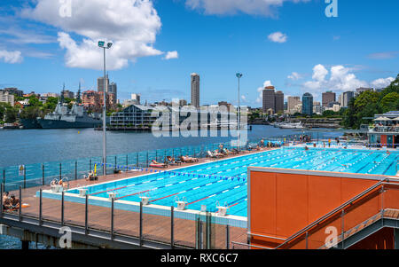 23rd December 2018, Sydney NSW Australia : View of outdoor Andrew Boy Charlton Pool with people and Woolloomooloo Finger Wharf and bay in background i Stock Photo