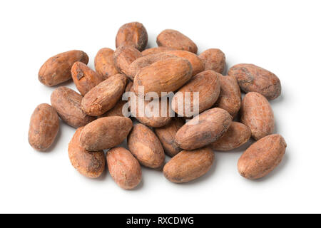 Heap of whole cocoa beans close up isolated on white background Stock Photo