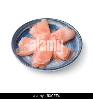 Pink pickled sushi ginger slices in bowl on white background Stock Photo