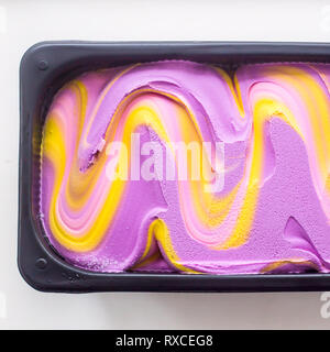 Multicolored pink, blue and purple gum taste ice cream in metallic form Stock Photo