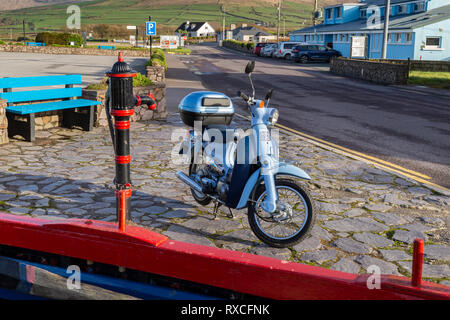 Portmagee Fishing Village, County Kerry, Ireland with Honda Little Cub moped Stock Photo