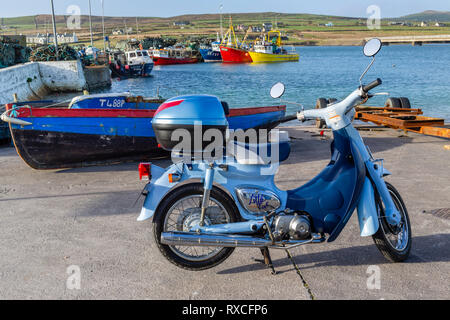 Portmagee Fishing Village, County Kerry, Ireland with Honda Little Cub moped Stock Photo