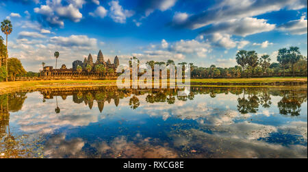 Angkor Wat temple reflecting in water of  Lotus pond at sunset. Siem Reap. Cambodia. Panorama Stock Photo
