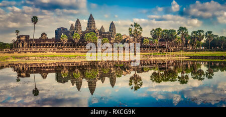 Angkor Wat temple reflecting in water of  Lotus pond at sunset. Siem Reap. Cambodia. Panorama Stock Photo