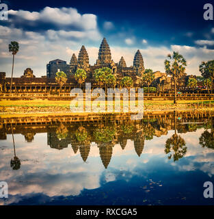 Angkor Wat temple reflecting in water of  Lotus pond at sunset. Siem Reap. Cambodia. Stock Photo