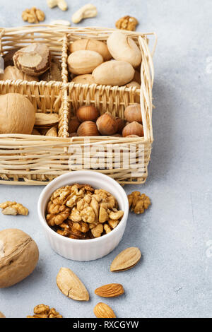 Various nuts in a basket - almond, walnut, hazelnut, pecan, brazil nut Stock Photo