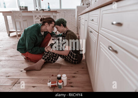 Husband showing all his love to his hopeless depressed wife Stock Photo