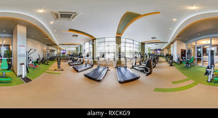 360 degree panoramic view of MINSK, BELARUS - AUGUST, 2017: Full spherical seamless 360 degree angle view panorama in big stylish fitness club with sports equipment and simulators