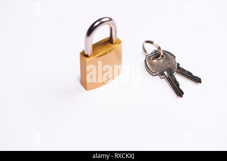 Key lock locked with keys on table Stock Photo