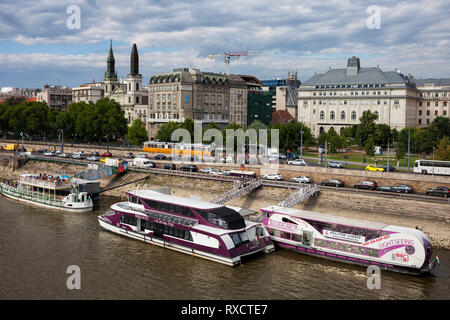 City of Budapest in Hungary, sightseeing cruise and tour boats on Danube River Stock Photo