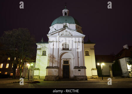 Poland, Warsaw, St. Kazimierz Church at night in New Town, Baroque style architecture Stock Photo