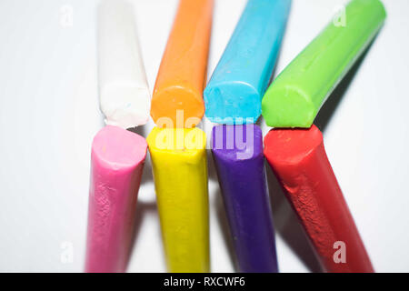 Crafts created with multi-colored clay sticks Stock Photo