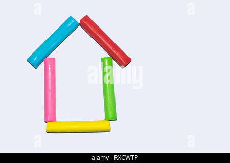 Colorful clay plasticine, modeling clay house isolated on a white paper, house icon Stock Photo